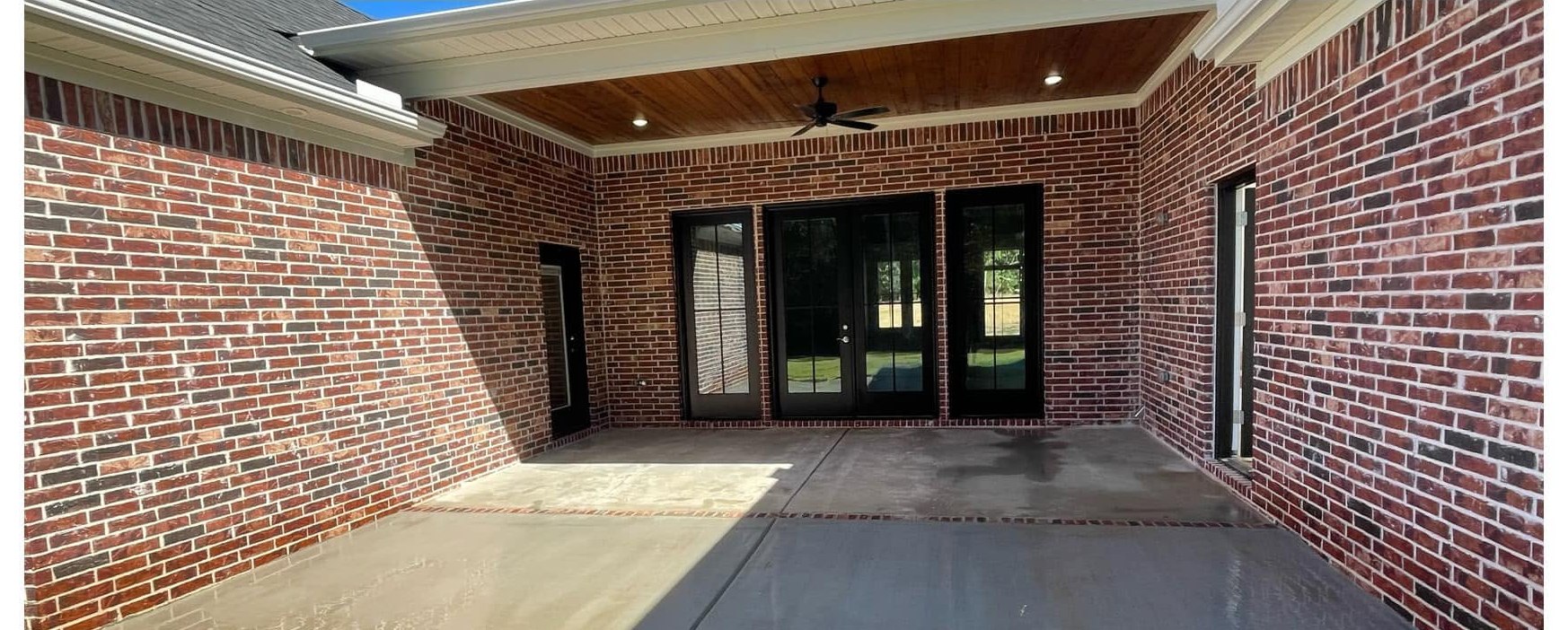 Back patio after power washing by Gann