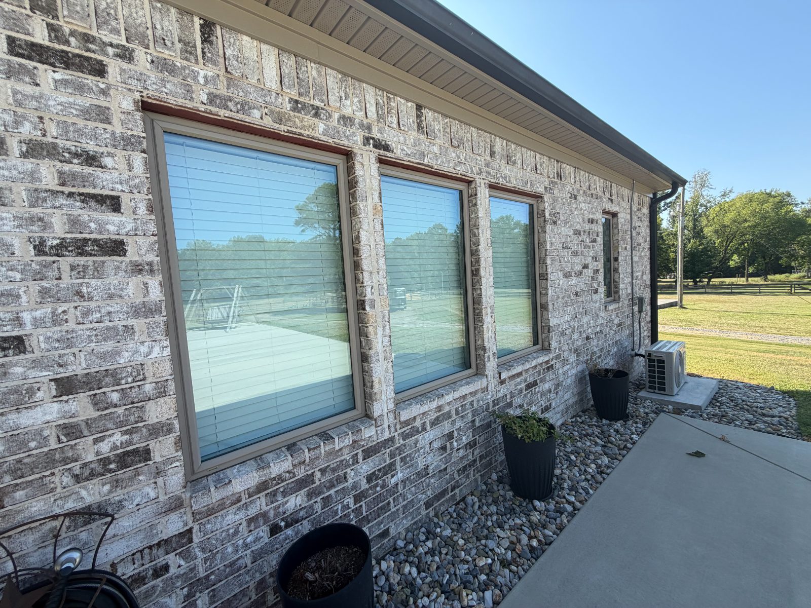 Freshly cleaned windows on a brick home